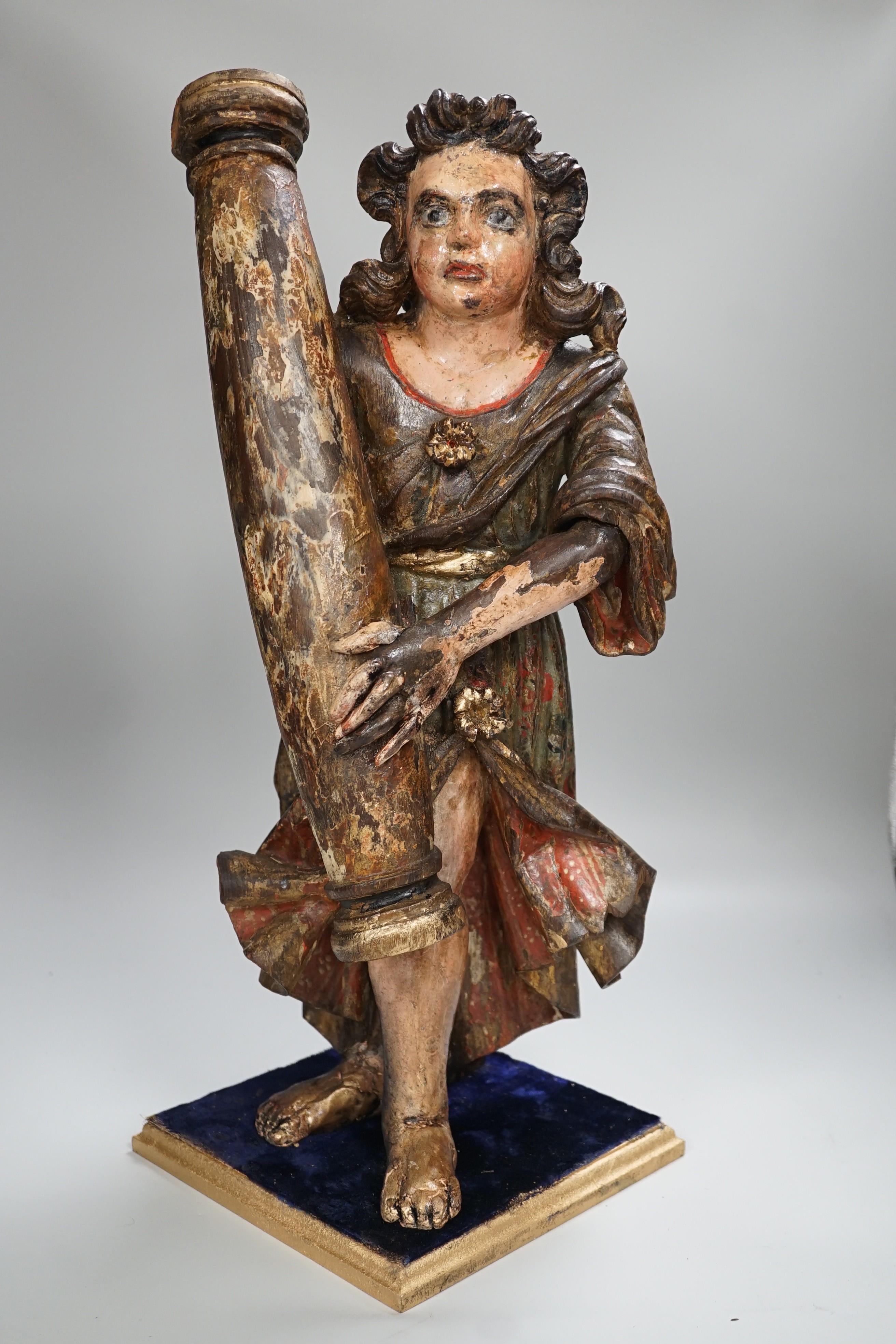 A carved wood polychrome model of a Saint, 53cm